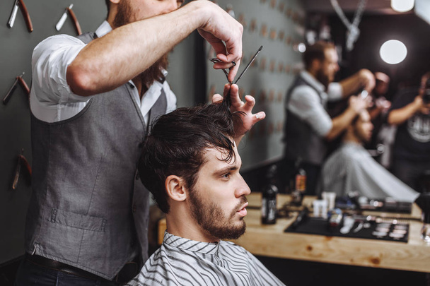Barbershop. Man with beard in barber shop. Modern hair salon - Foto, immagini