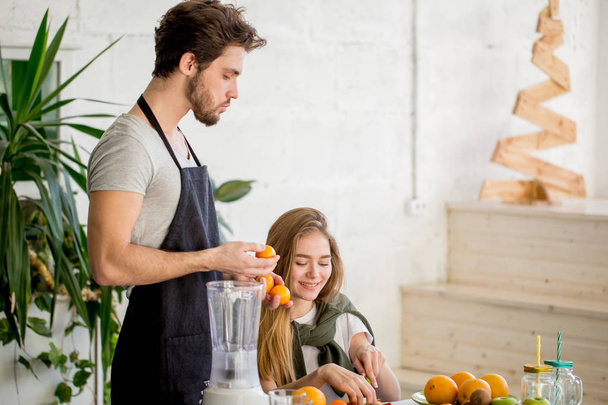 a couple making yogart with fruits - Foto, Bild