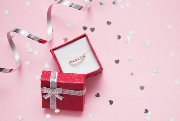 Gift box with jewerly on festive background with glitters. - 写真・画像