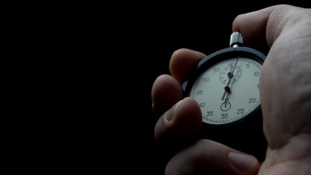 Chronomètre analogique dans la main de l'homme
 - Séquence, vidéo