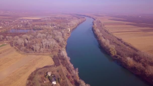 Slow drone flight over blue river and agricultural lands. Dniester river, Moldova republic of. 4K birds eye view - Footage, Video