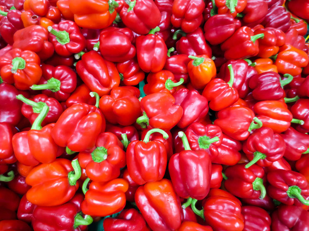 Laying out sweet red pepper on the food market, background. - Photo, Image