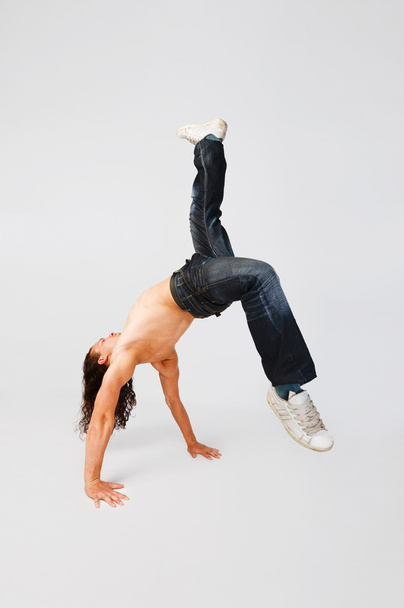 Cool breakdancer making out on plain background - Фото, изображение