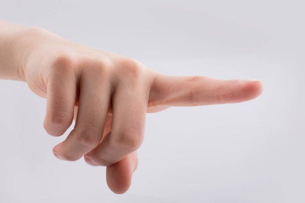 Hand pointing gesture on a white background - Photo, Image