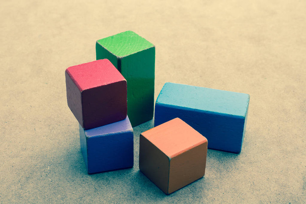 Colorful building  blocks on a brown background - Photo, Image