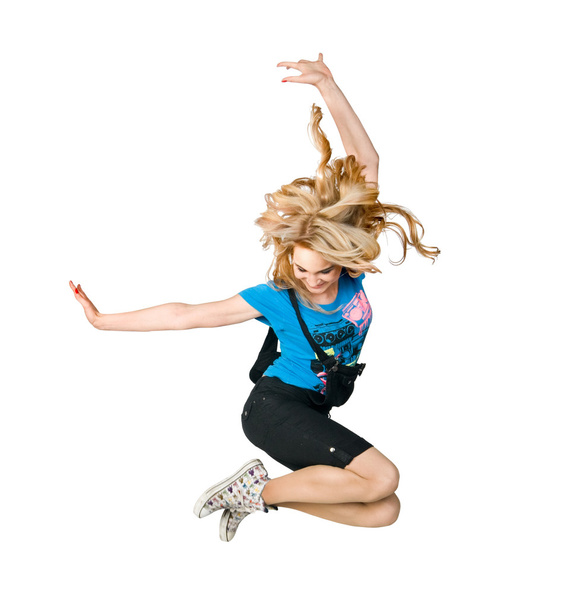 Excited girl jumping high on white - Fotó, kép