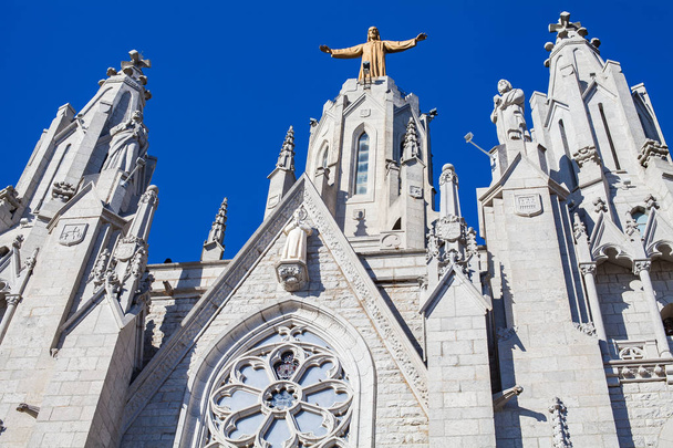 Roman-catholic basilica in Barcelona , Catalonia - gothic architecture against blue sky - 写真・画像