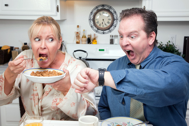 Stressed Couple Eating, Looking at Time - Photo, Image