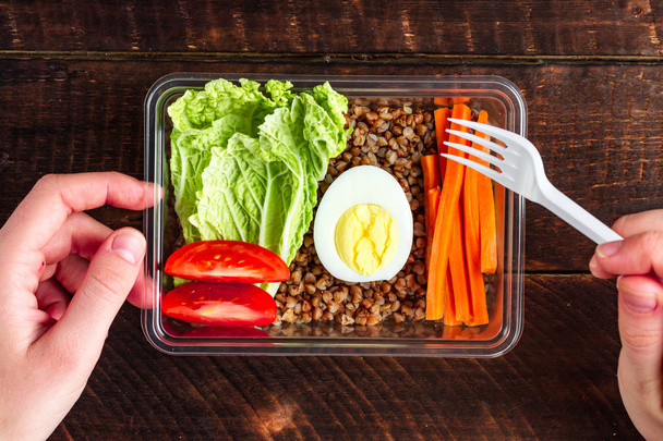 Healthy, dietary, healthy meal in a plastic container. Lose weight, eat right. Snack at work, in the office at lunch time, during a break. Lunch box   - Foto, Imagen