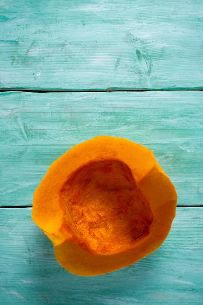 slice of pumpkin on wooden surface - Фото, изображение