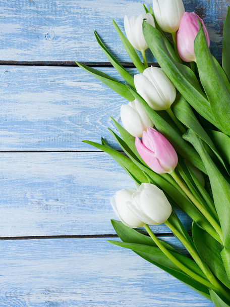 beautiful fresh tulips on wooden surface - Photo, Image