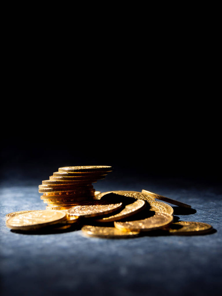 Real Gold coins over dark background - Foto, Imagen