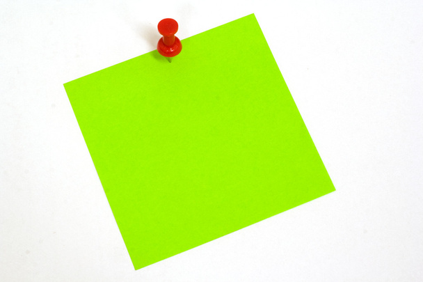 Green sticker note isolated on the white - 写真・画像