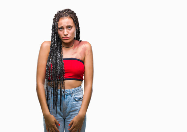 Young braided hair african american with pigmentation blemish birth mark over isolated background depressed and worry for distress, crying angry and afraid. Sad expression. - Foto, imagen