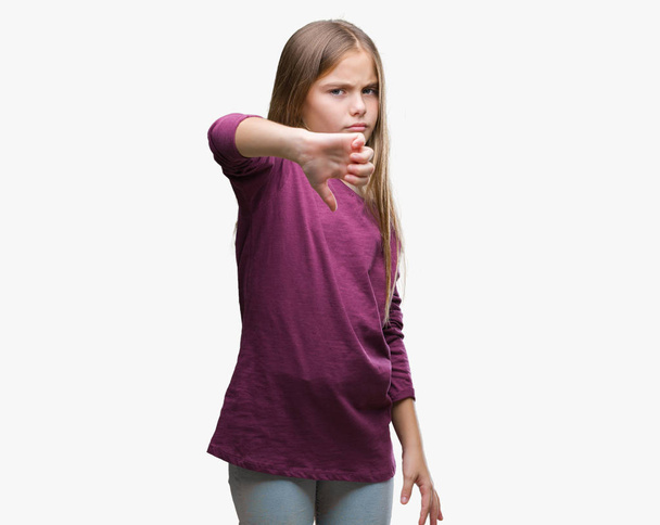 Young beautiful girl over isolated background looking unhappy and angry showing rejection and negative with thumbs down gesture. Bad expression. - Foto, afbeelding