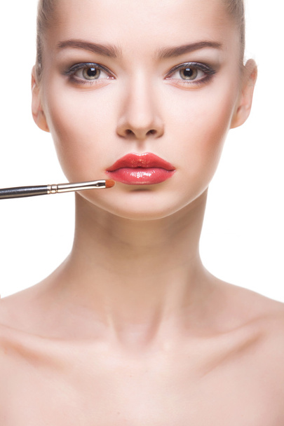 Portrait of woman with lips-brush - Photo, Image