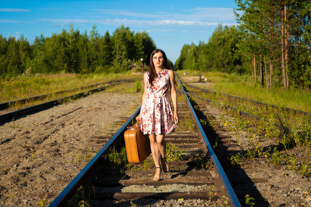 girl on the tracks waiting for the train and travel - Photo, Image
