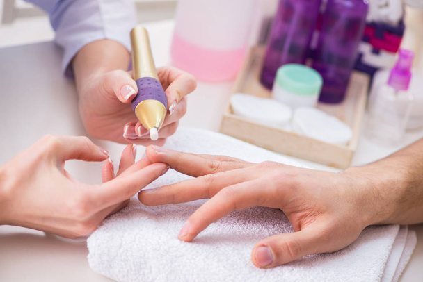 Hands during manicure care session - Photo, image