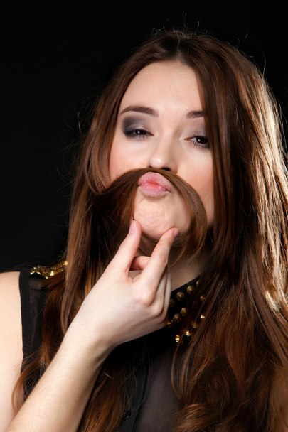Grimacing. Girl hair moustaches making silly face - Foto, imagen