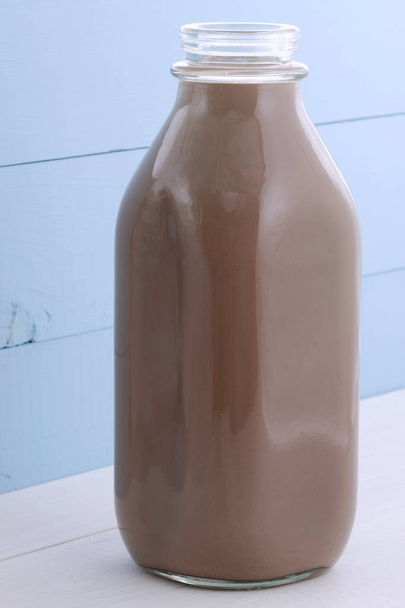 Delicious fresh chocolate milk, on vintage styling. - Foto, imagen