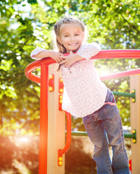 little girl on outdoor playground - Foto, Bild
