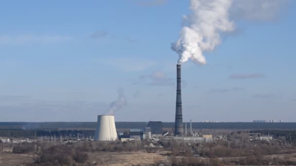 Power plant with steam and smoke raising in the sky - Footage, Video
