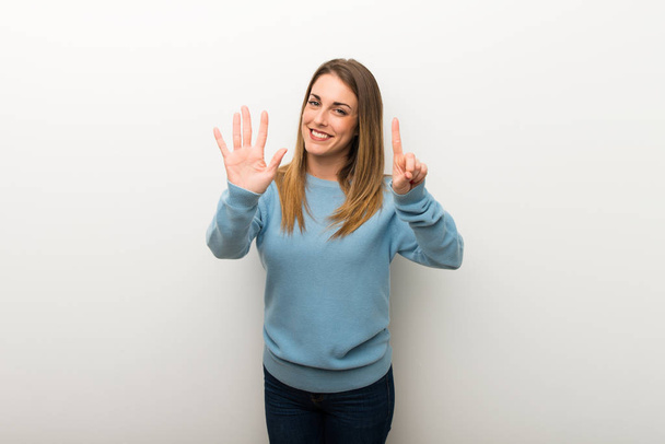 Blonde woman on isolated white background counting six with fingers - Photo, Image