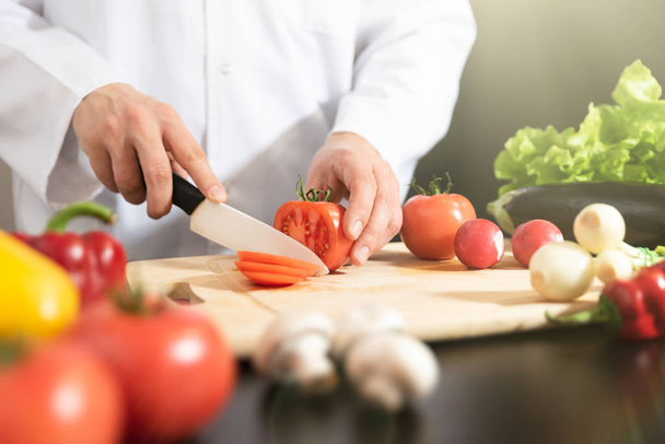 Chef prepares fresh vegetables. Cooking, healthy nutrition concept - Foto, immagini