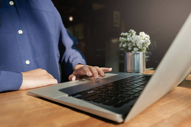 woman using laptop, searching web, browsing information, having workplace at cafe - Photo, Image