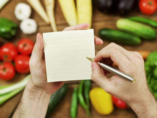 Holding a blank groceries list - Photo, Image