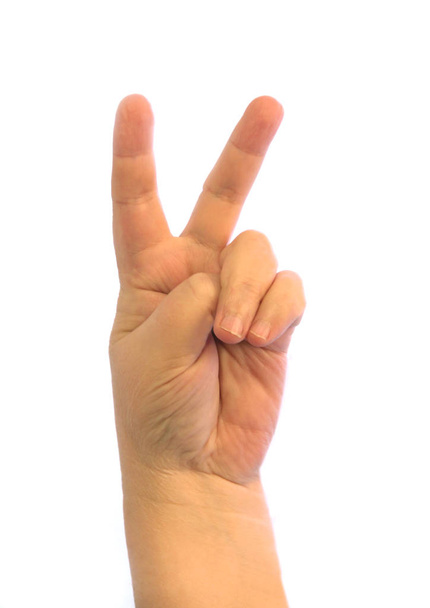 Рука с пальцами, показывающими знак победы
 - Фото, изображение