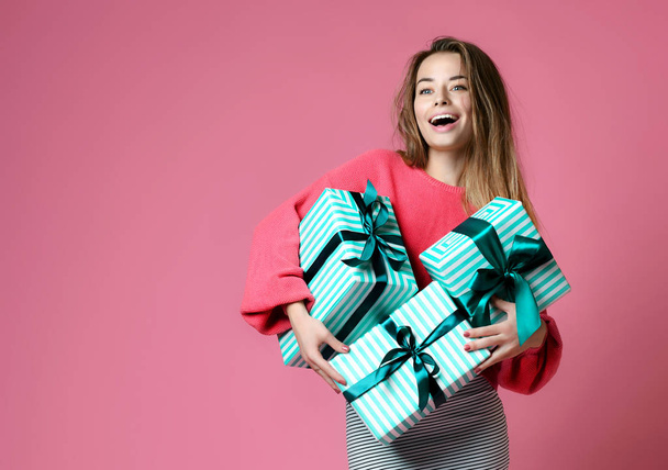 Beautiful young woman shopping hold pastel green color presents gift boxes for valentines day or birthday celebration  - Foto, afbeelding