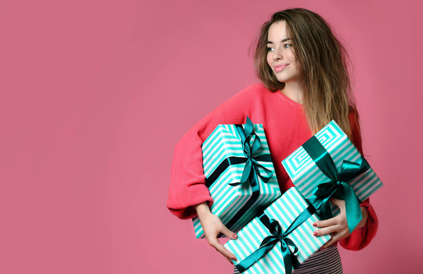 Beautiful young woman shopping hold pastel green color presents gift boxes for valentines day or birthday celebration  - Foto, immagini