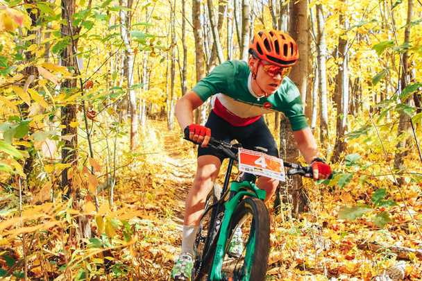 October 14, 2018, Minsk, Belarus.2018 Olympic Cross Country Cup XCO in Medvezhino A man cycling along a forest trail - Φωτογραφία, εικόνα