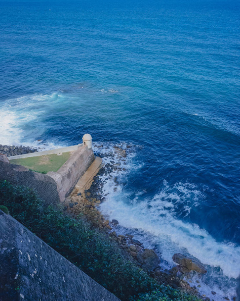 View of fortress wall and sentry box over blue sea in Old San Juan, Puerto Rico - Photo, Image