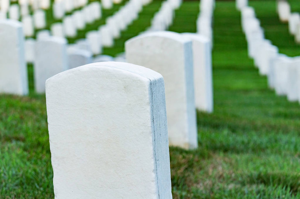 Grave stones on a peaceful cemetery, selective focus on a front stone. - 写真・画像