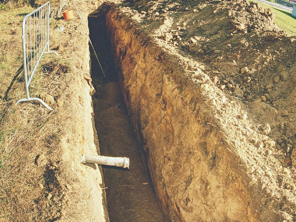 Underground pipe connector, maintenance and repair of water pipe leak in trench. - Photo, Image