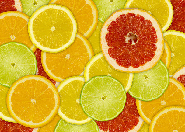 abstracte achtergrond met citrus-fruit plakjes - Foto, afbeelding