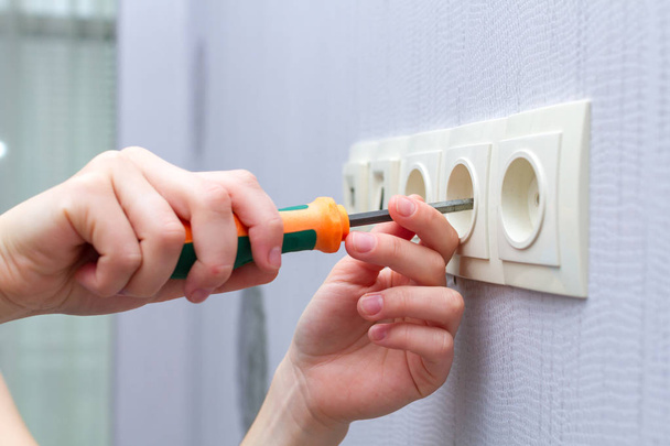 Repair wall sockets with a screwdriver - Photo, image