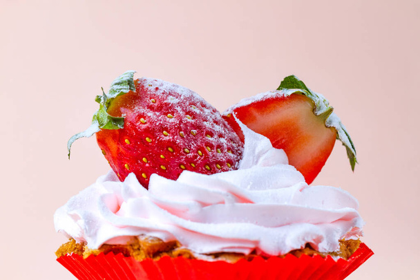 Tasty strawberry cake with whipped cream on a pink background. Pastry. Sweet dessert - Фото, зображення