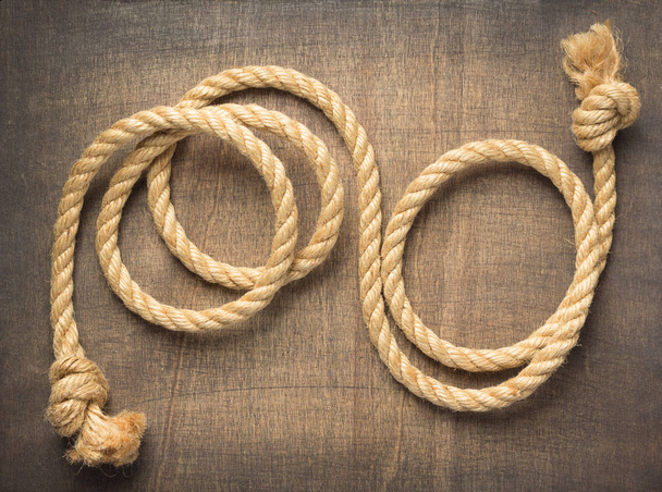 ship rope at wooden background surface, top view - Фото, зображення