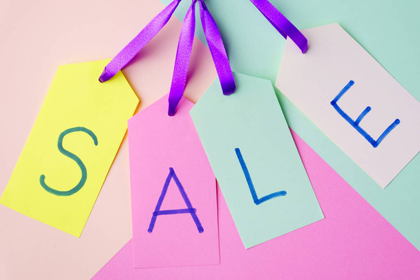 spring sale, price tags on pastel background  - Foto, Imagem
