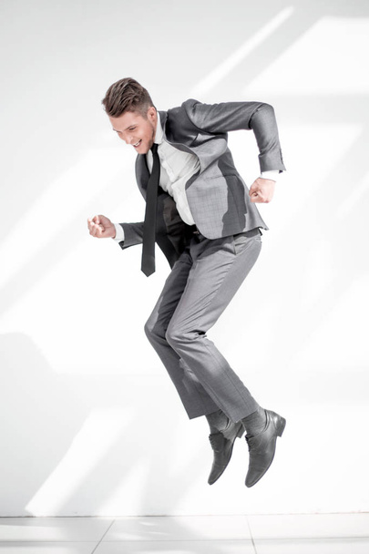 Full-length jump of a young man jumping with an open mouth, isol - Foto, Imagem