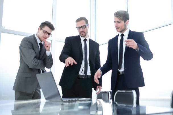 three business people standing near the desktop - Photo, image