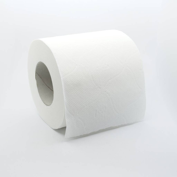 Shot to a toilet paper roll over white background. - Photo, Image