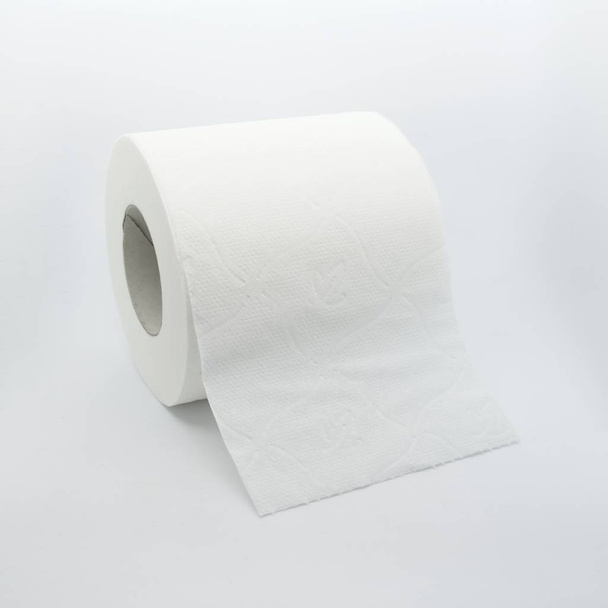 Shot to a toilet paper roll over white background. - Photo, Image