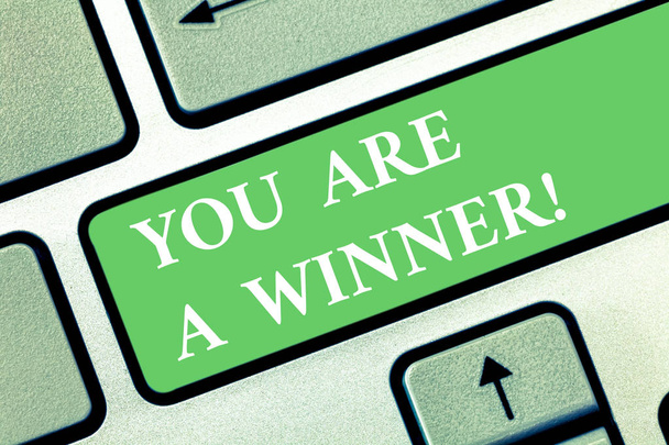 Writing note showing You Are A Winner. Business photo showcasing Motivation inspirational support for you accomplish goals Keyboard key Intention to create computer message pressing keypad idea. - Photo, Image