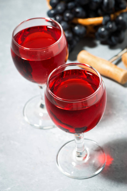 two glasses of red wine on a gray table, top view vertical - Photo, image