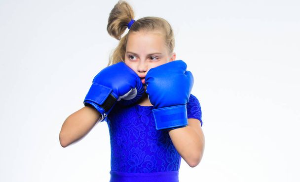Boxing sport for female. Be strong. Girl child with blue gloves posing on white background. Sport upbringing. Upbringing for leadership and winner. Strong child boxing. Sport and health concept - Фото, зображення
