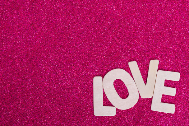 Word LOVE on pink color background, valentine - Foto, imagen